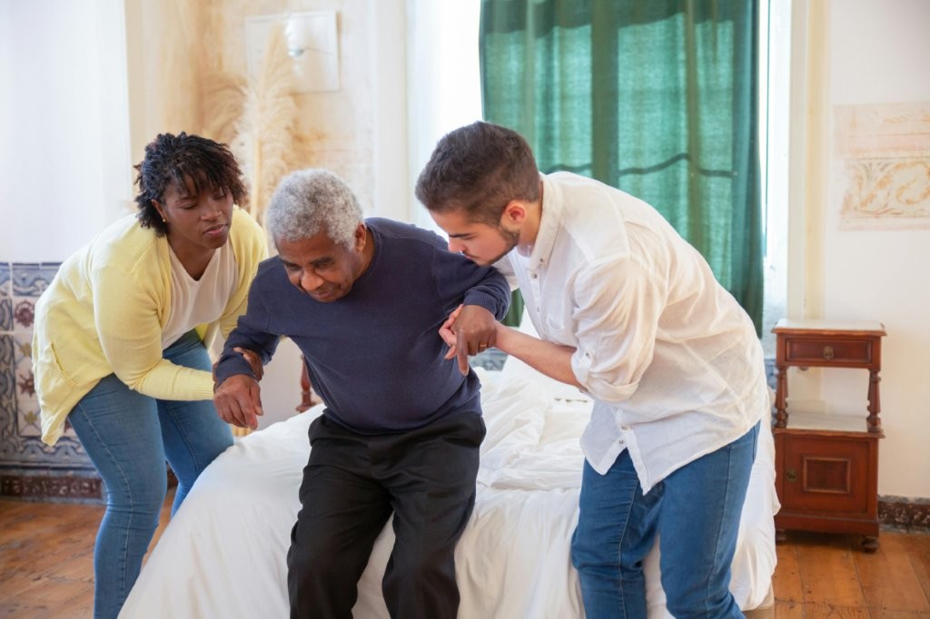 Caregiver with elderly man smiling